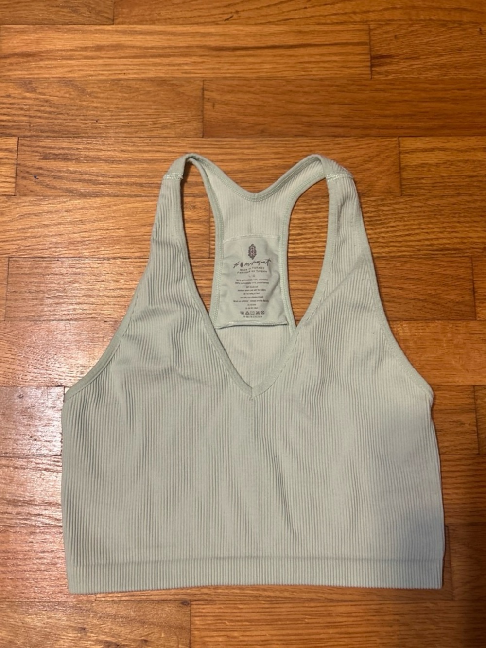 FP Movement Ribbed V‑Neck Racerback Bralette in Pale Green